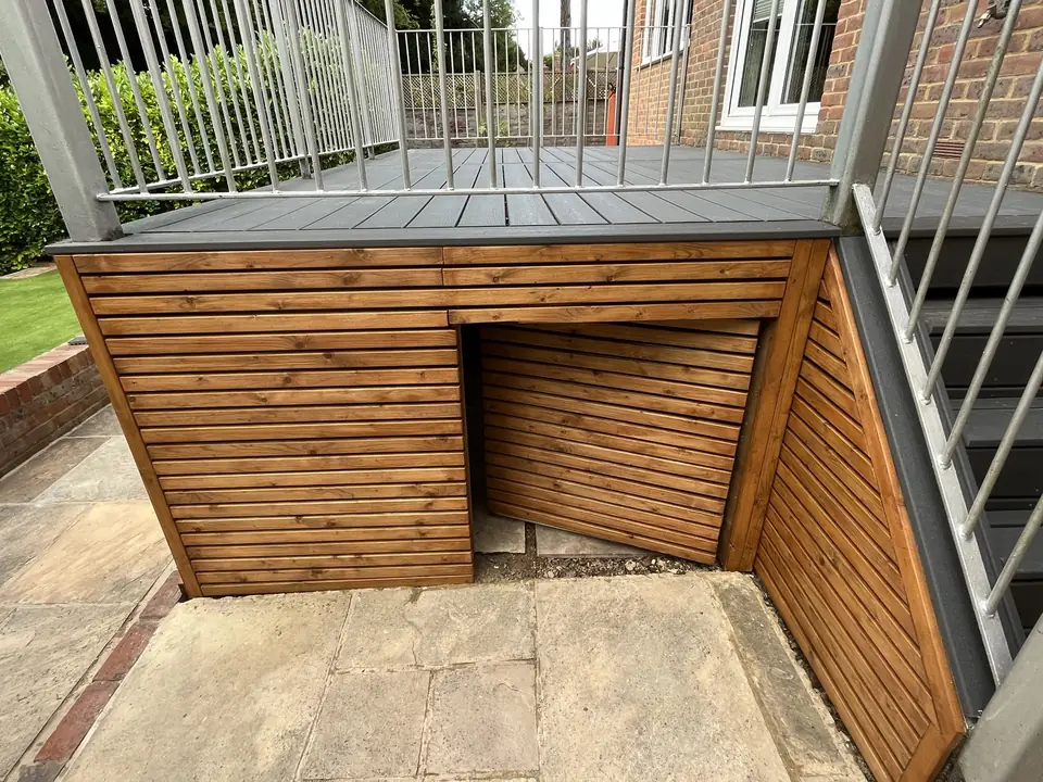 Slatted timber storage built beneath a raised composite deck
